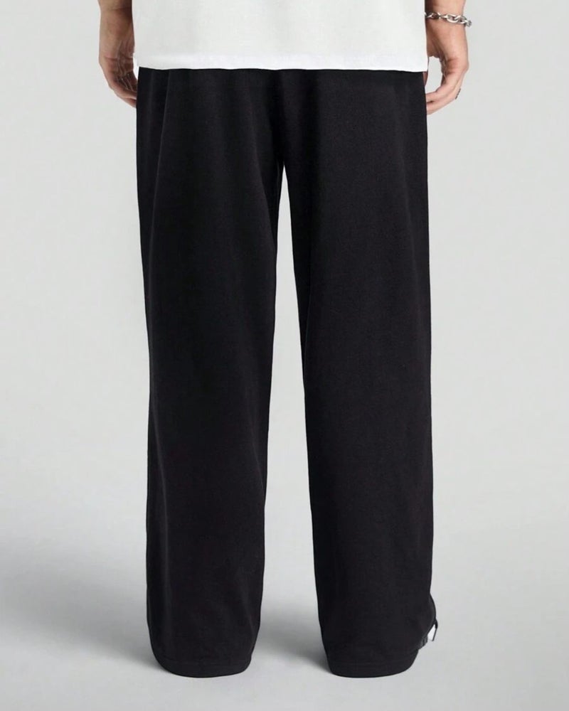 فلاينوف بنطلون رياضي رجالي أسود سادة بقصة فضفاضة - Image 2